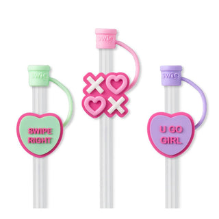 Discover the "Be Mine Straw Set" from Western Edge Boutique: a collection of three vibrant reusable straws featuring pastel silicone charms—a heart inscribed with "SWIPE RIGHT," playful Xs and hearts, and an inspiring "U GO GIRL." These are the perfect tumbler accessories to brighten your day!