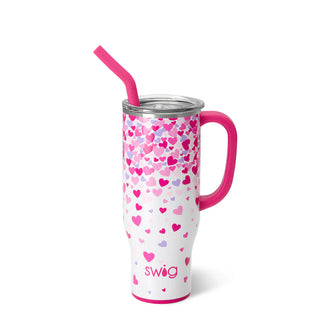 This "Fall in Love" Valentine's tumbler from Western Edge Boutique is a 30oz stainless steel cup, beautifully decorated with pink and purple heart patterns. It comes with a pink handle, a clear lid, and a matching straw, featuring the brand name elegantly printed near the base—ideal for making anyone swoon at first sip.