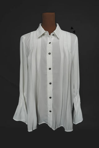 The WYOMING DAZE White Button Up Top by 2FLY is displayed against a dark background. This white long-sleeve blouse, crafted from linen-style fabric, features vertical pleats down the front and flared bell sleeves, giving it a slightly flowy appearance.