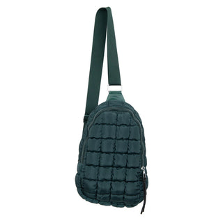 The Ellison Quilted Crossbody Handbag from Western Edge Boutique is a dark green accessory featuring an adjustable strap and zipper closure. It boasts a square-patterned, padded design that is both sleek and modern.