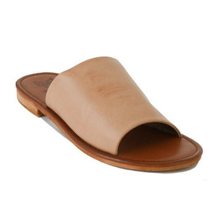 The Quinn Nude Slide Sandals by Western Edge Boutique feature a wide strap of tan leather and a flat sole, viewed from an angle. True to size and exceptionally comfortable, this stylish footwear is perfect for any casual outing.