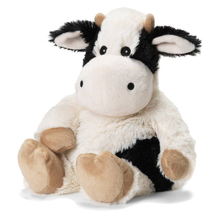 Introducing the Patterson Black and White Warmies Cow by Warmies—this plush toy cow boasts a soft, fluffy texture with black and white fur adorned with black patches. It features beige horns, black ears, and beige hooves. Its round, friendly face is complemented by black eyes and a beige muzzle. Additionally, this microwaveable Warmies® Plush animal contains soothing French lavender for extra comfort.
