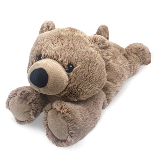 The Kitt Brown Bear Warmies by Warmies, featuring a plush brown exterior and a round black nose, lies on its stomach with its front paws outstretched. Infused with soothing warmth and French lavender, the bear boasts a soft, fuzzy texture and a friendly, inviting expression.